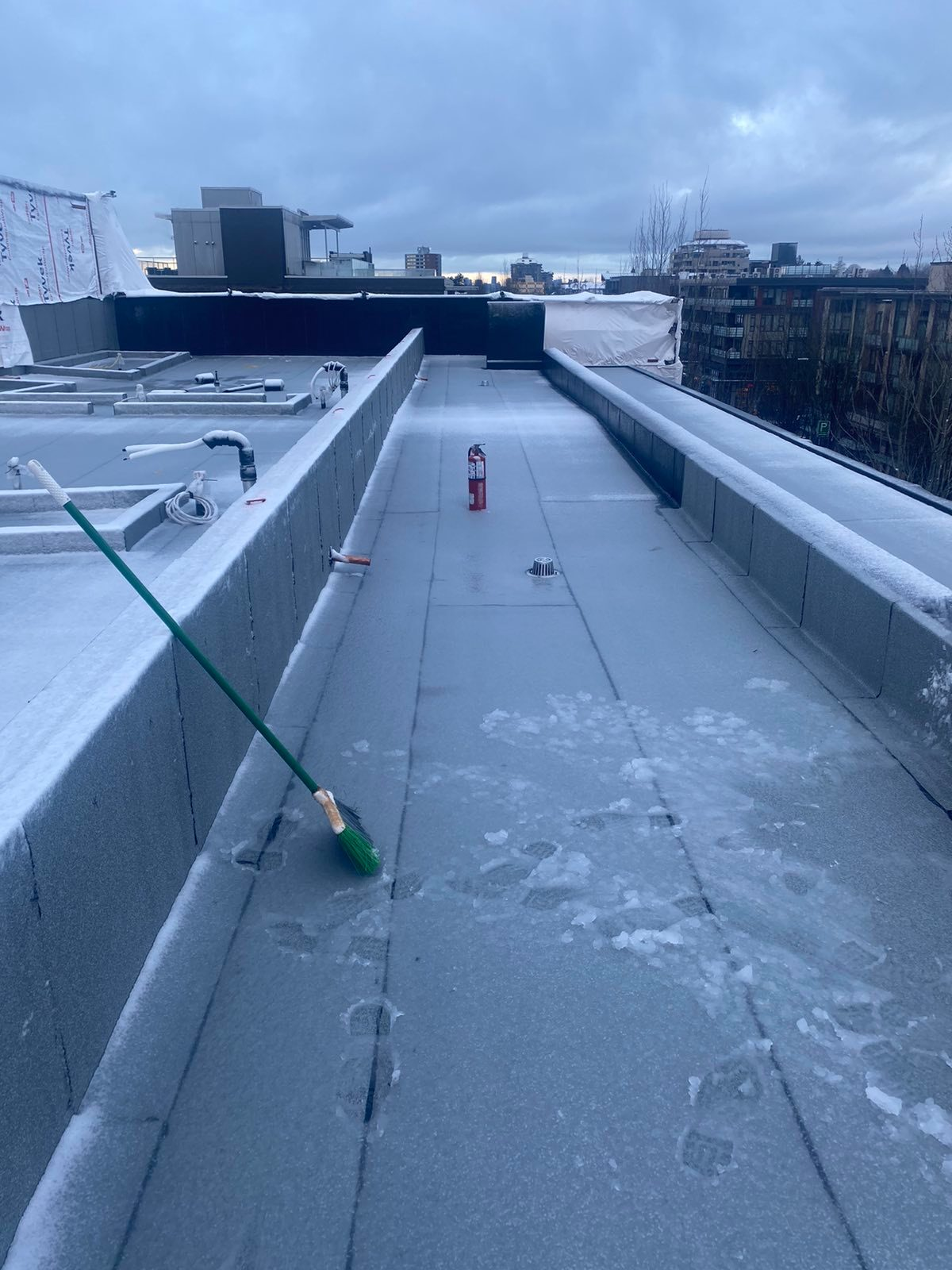 Winter roof maintenance clearing snow
