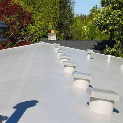 White PVC membrane roof around vent stacks