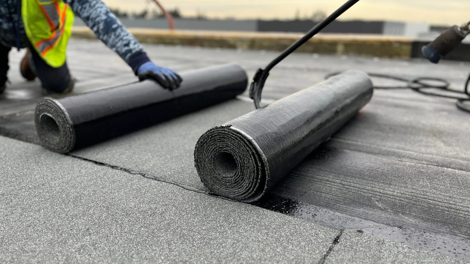 SBS modified bitumen membrane being torch-applied